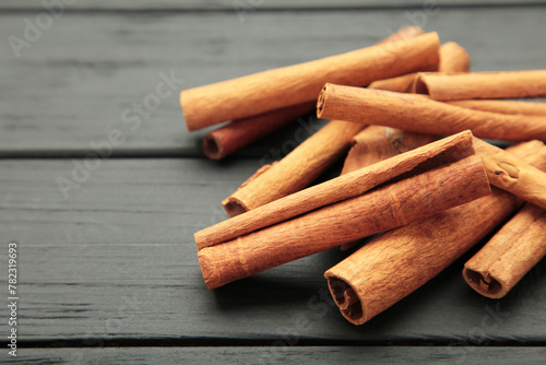 Cinnamon sticks on black background. Macro photo