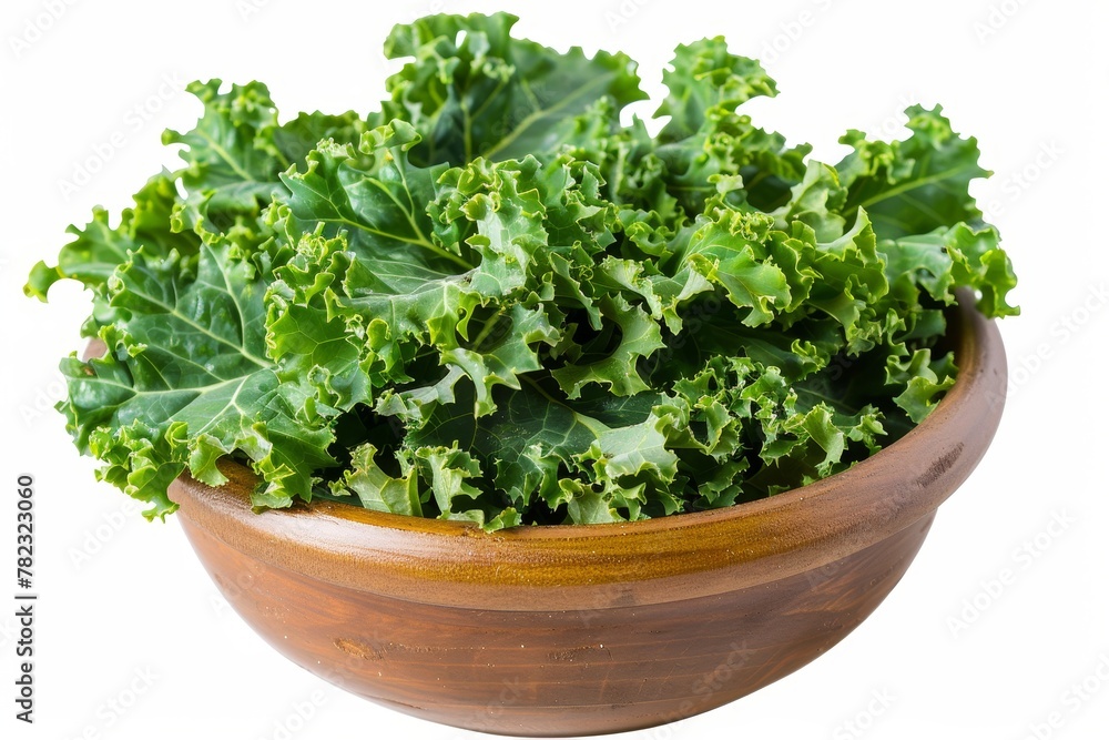 Green curly kale leaves in a white bowl macro shot Green curly kale leaves in a white bowl macro shot