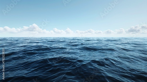 Deep blue ocean with gentle waves and a clear blue sky.