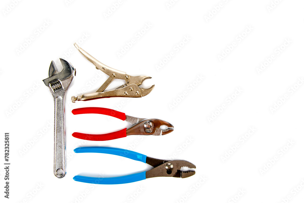 Mechanic hand tools pliers and adjustable monkey wrench overhead view isolated on a white background 