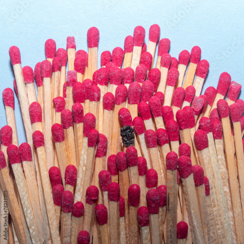 Matches representing individual in a crowd creative people concept.
