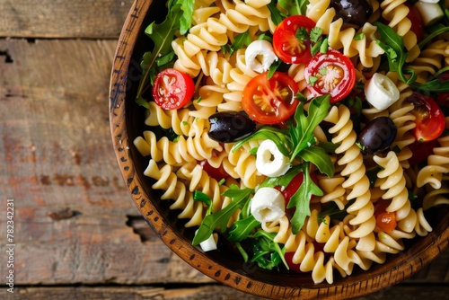 Cold pasta salad with fusilli tomato mozzarella olive arugula