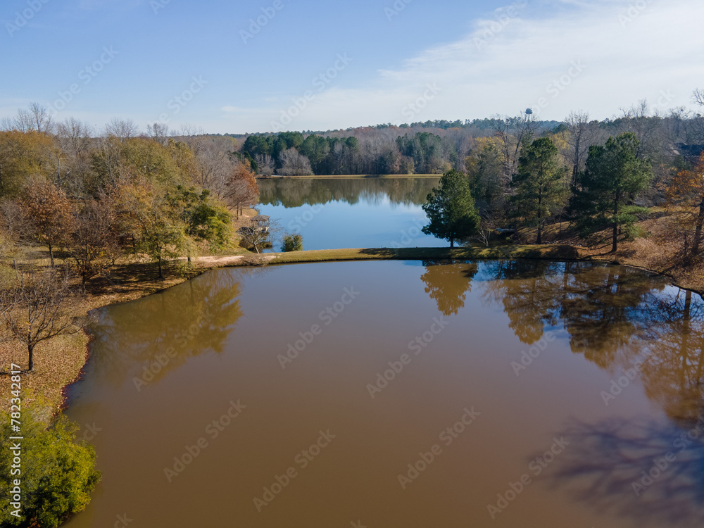 Aerial landscape of trees and a pond in rural edge of southern Augusta Georgia