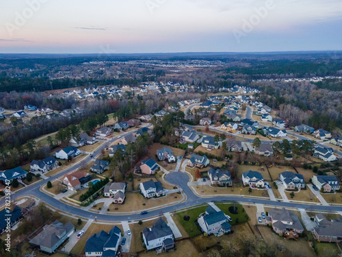 Aerial sunset landscape of forest and suburban neighborhood in Evans Augusta Georgia