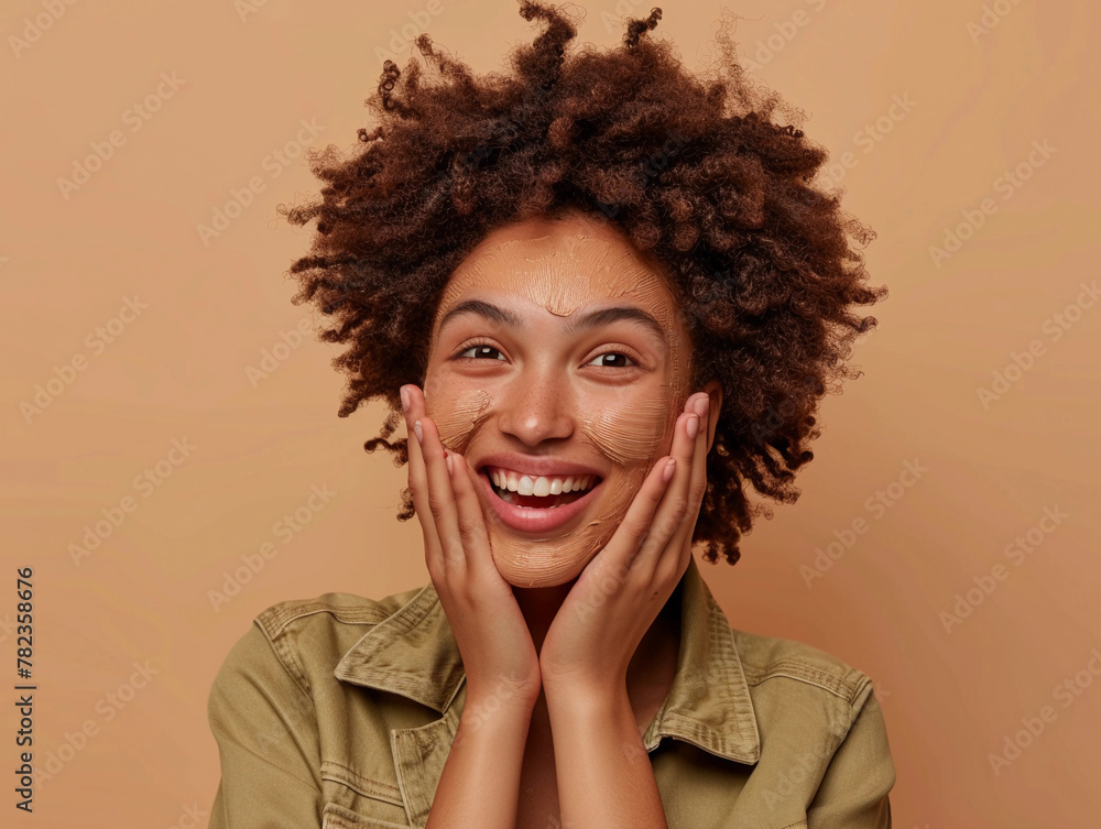 Close up photo of cheery young lady curly hair enjoy facial peeling effect dressed trendy khaki outfit isolated on beige color background Close up photo of cheery young lady curly hair enjoy facial peeling effect dressed trendy khaki outfit isolated on beige color background