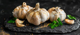 Garlic (Allium sativum) is a bulbous plant in the onion genus, known for its pungent aroma and culinary uses. Medicinally, it is valued for its antibacterial, antiviral, and antifungal properties
