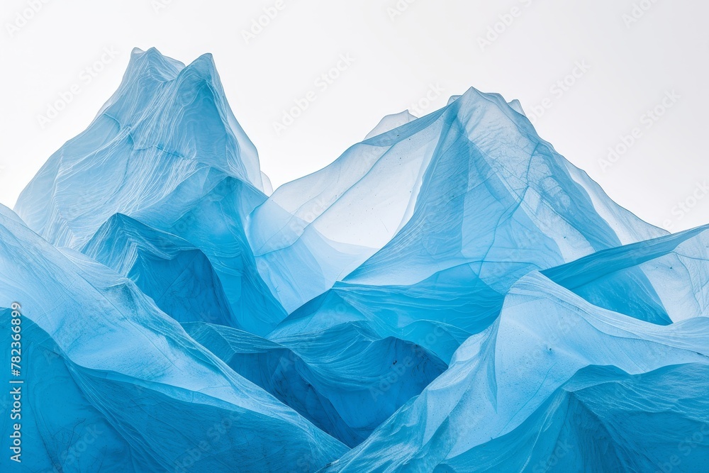 Obraz premium Artistic Abstract Representation of Frozen Peaks Using Blue Fabric, Capturing the Essence of Cold and Elevation.