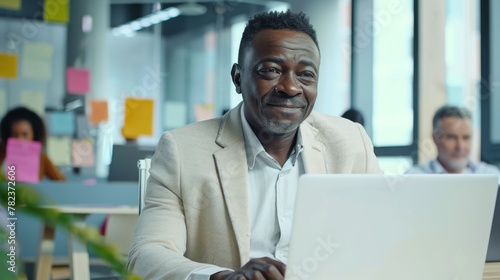 Smiling Man at His Laptop