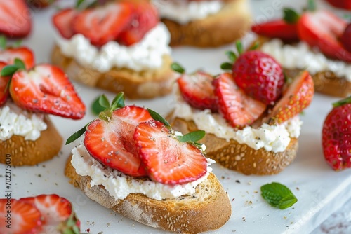 Toasted bread with goat cheese and strawberries