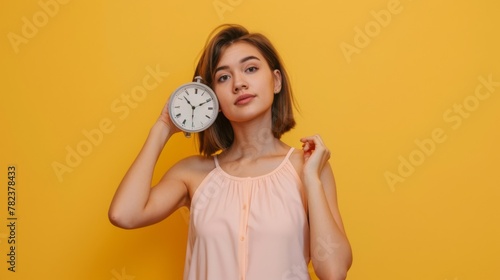 Woman Holding a White Clock photo