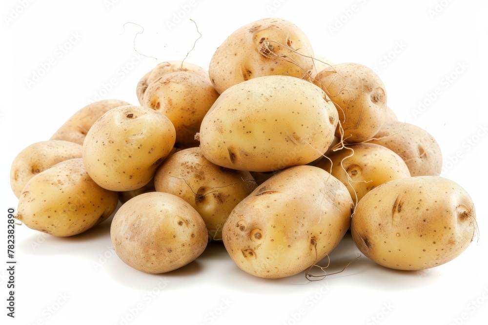 Heap of potatoes on white backdrop in close up shot Heap of potatoes on white backdrop in close up shot