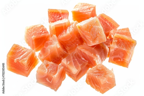 Isolated salmon slices for sushi or salad with clipping path red fish cubes