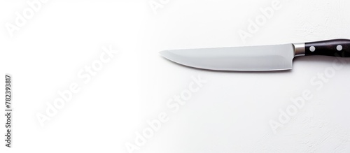 Knife on a blank white surface