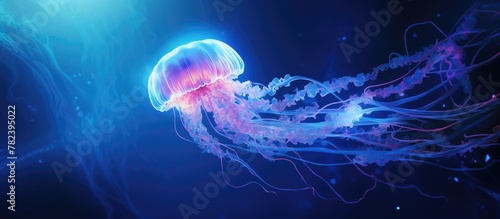 Jellyfish swimming amid ocean's blue light