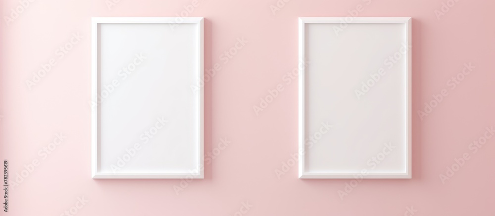 Two white frames on pink wall Two white frames on pink wall