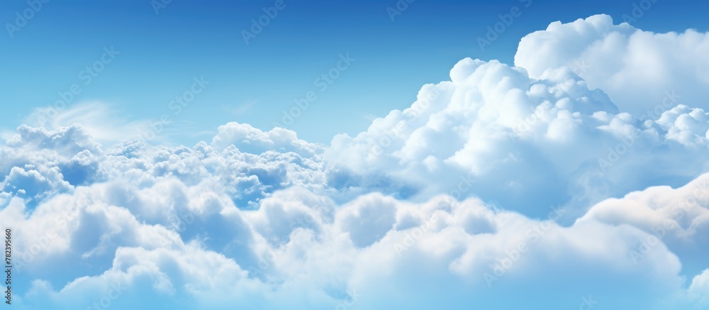 Plane flying in clear blue sky with white clouds