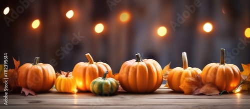Pumpkins and Leaves on Wooden Table
