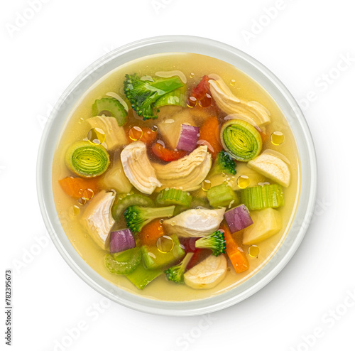 Chicken soup with vegetables isolated on white background, top view