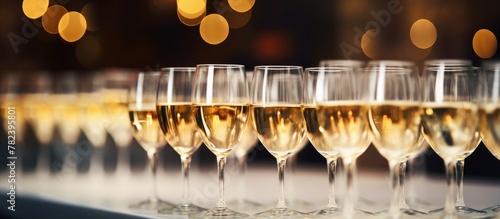 Table with a row of champag...