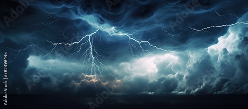 Dark sky illuminated by intense lightning strikes photo