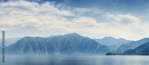 Mountains under serene clou...