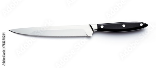A knife on a plain white su...