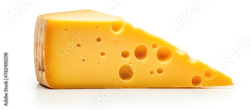 Piece of holey cheese up close