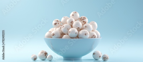 A bowl filled with eggs, in...