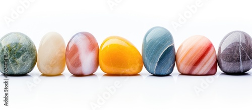 Colorful array of stones on white base photo