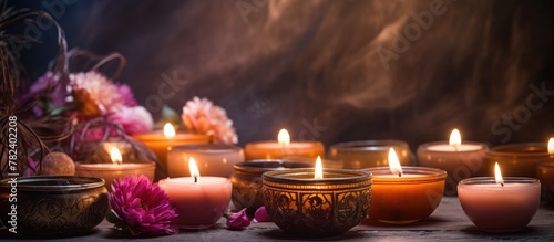 Row of Lit Candles with Flo...