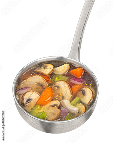 Ladle with mushroom soup, champignon broth isolated on white background, full depth of field