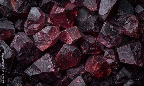 flat background adorned with the natural texture of raw garnet gemstones photo