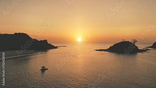 Sunset seascape of ocean bay at tropic islands aerial. Nobody nature landscape with palm trees at sand beach. Summer paradise resort at sea gulf. Sandy shore of El Nido Islet, Philippines, Asia © Goinyk
