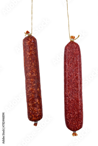 Two hanging raw smoked sausage isolated on white background