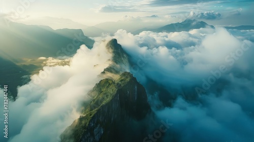 mountain peaks above the clouds. © Yahor Shylau 