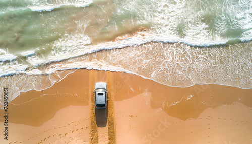 car rides on the sand of a sea beach, top view