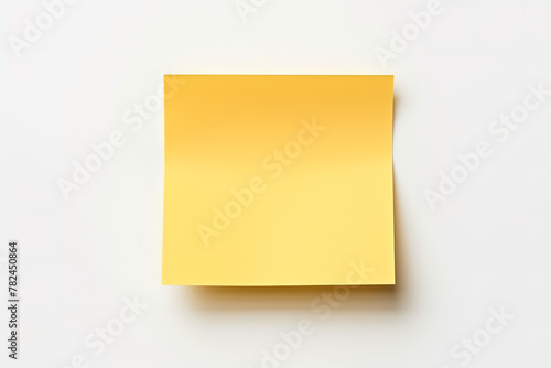 yellow color of blank sticky note, on the white wall, no other material, no tape on the paper, one sticky only