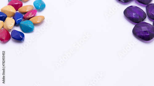 bright colored gemstones as a frame on white background