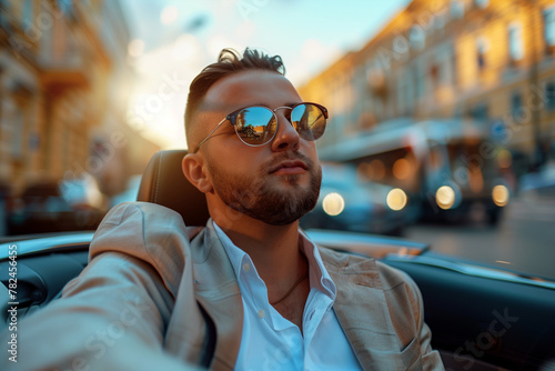 Man Wearing Sunglasses Sitting in Car © Dzmitry