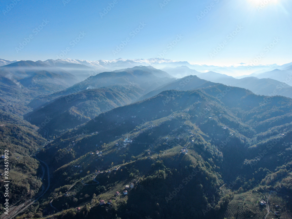 A stunning aerial view of a mountainous landscape shrouded in fog. mountains in trabzon Turkey