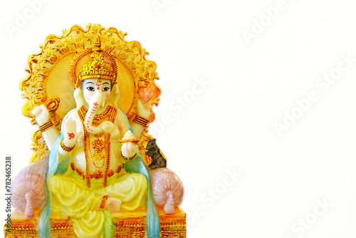indian hindu religion god ganesh or ganesha idol for offering prayers during hindu festival Ganesha chathurthi,wedding,white background,copy space