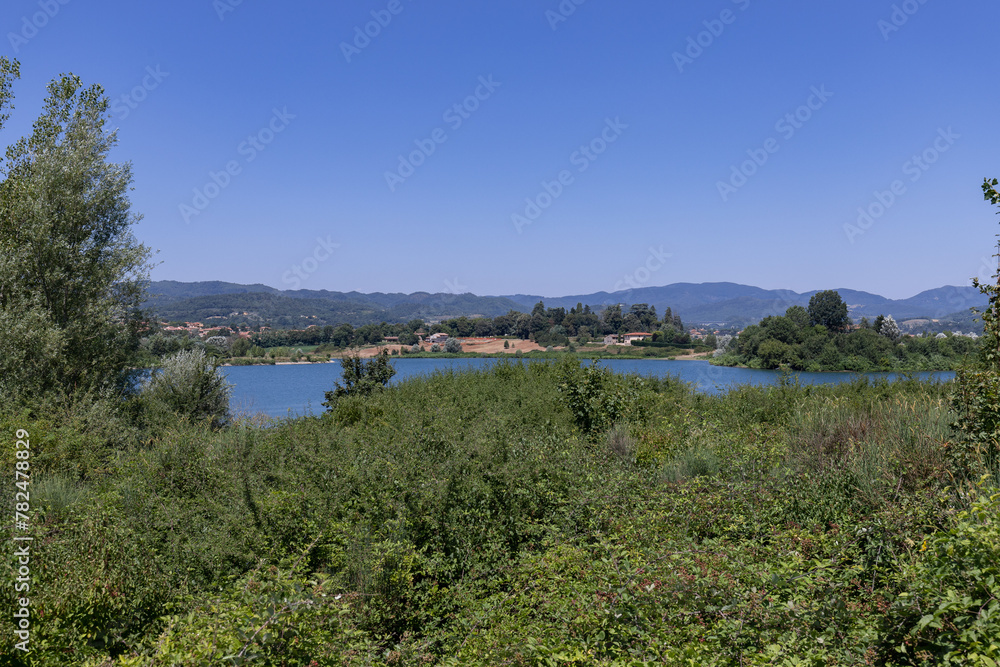The Bilancino Lake. Lago di Bilancino, Barberino del Mugello, Florence, Italy: landscape at dawn of the picturesque lake in the Tuscan hills The Bilancino Lake. Lago di Bilancino, Barberino del Mugello, Florence, Italy: landscape at dawn of the picturesque lake in the Tuscan hills
