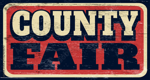 Aged and worn retro county fair sign on wood