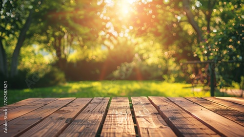 Wooden table in the garden at sunset. Selective focus.