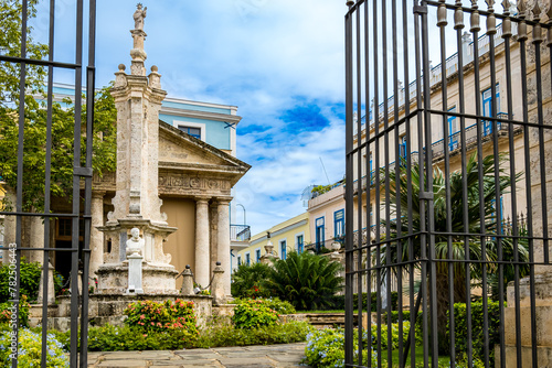 El Templete, a monument of Cuban heritage in Old Havana, showcases neo-classical architecture, Columna de Cacigal, Christopher Columbus statue and Ceiba Tree, echoing rich history and colonial charm.