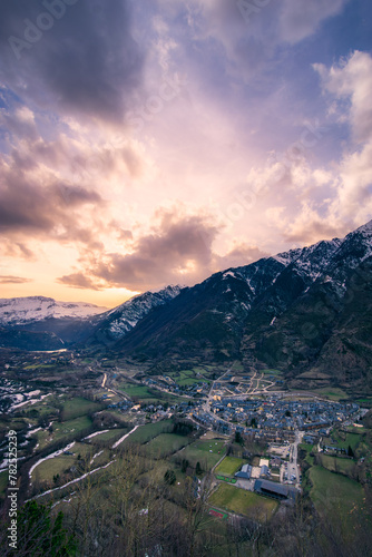 View of the village of Benasque at sunset with a spectacular sky. Winter landscape. photo