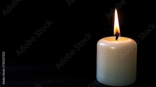 cute lit candle on black background in high resolution and high quality