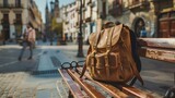 Brown hipster backpack on the bench in Spanish city old town square street. Solo traveler, tourism, travel, vacation concept