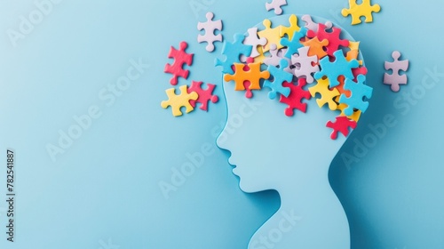 puzzle forming a head. world autism day concept on blue background in high resolution