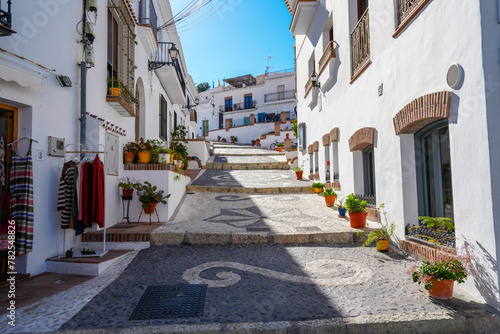Stairway sidewalk with pretty flower pots in the village of Frigiliana Spain